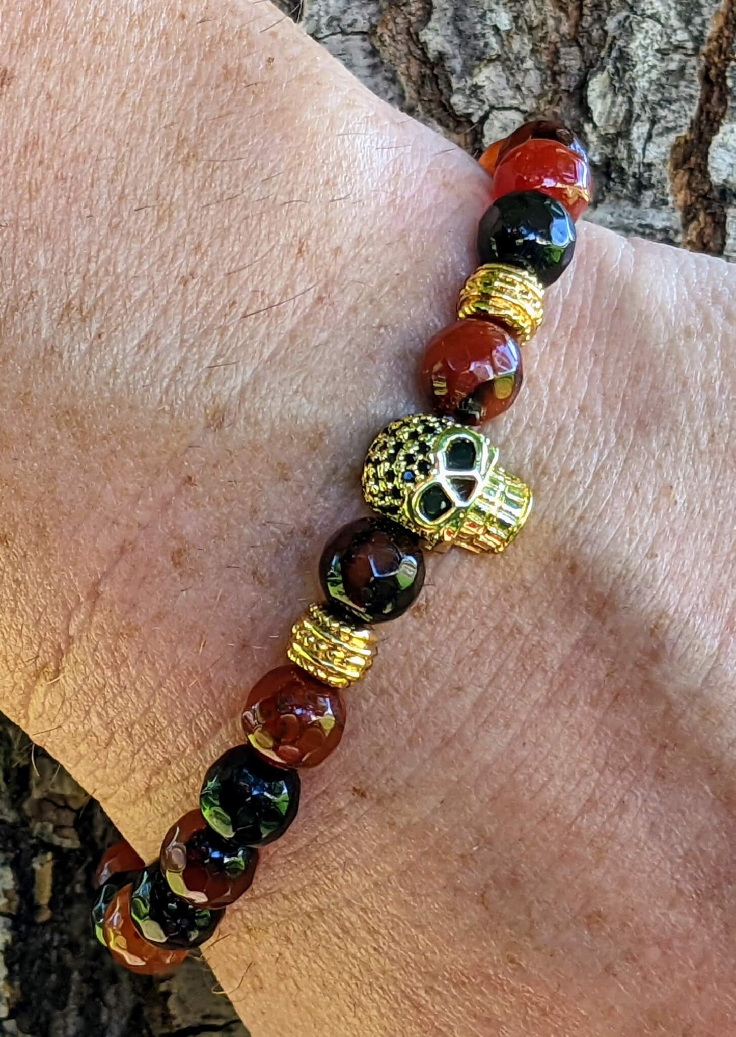 Gold Skull with Black & Red Agate